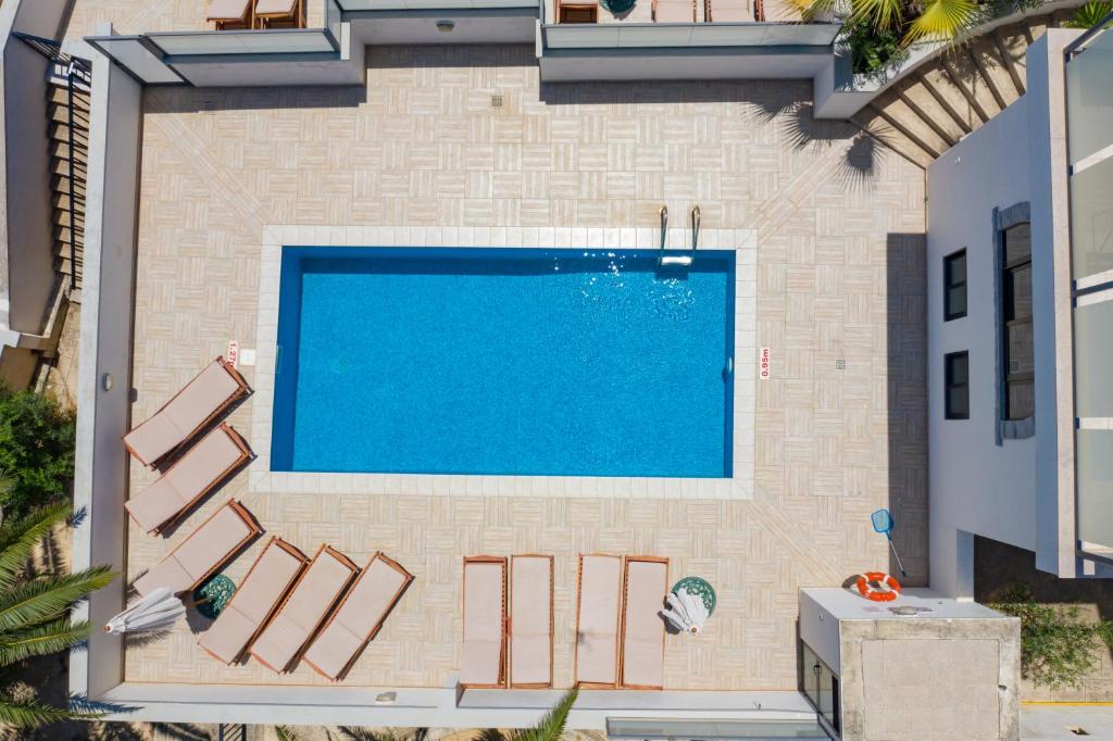 an overhead view of a swimming pool in a building at Baldacchino Holiday Villas in Mellieħa