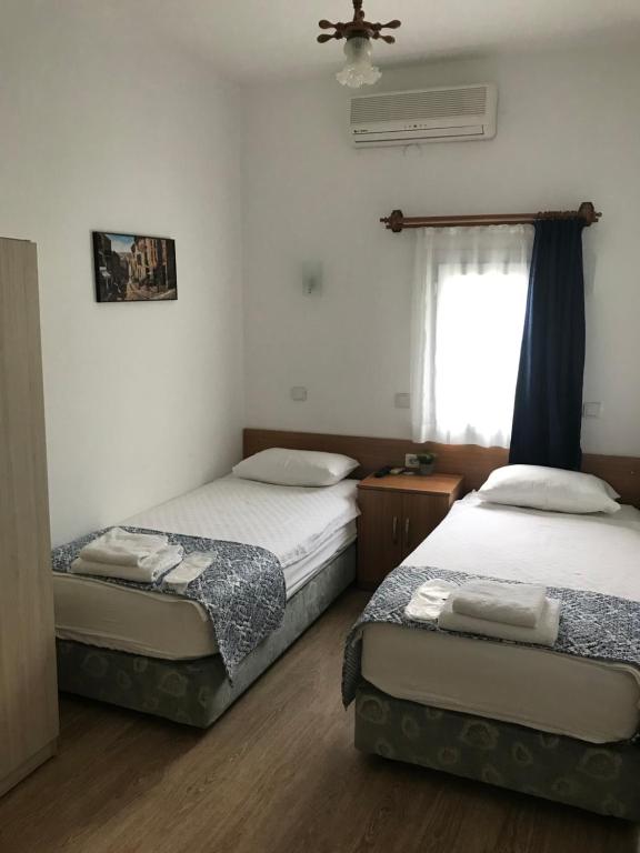 Postel nebo postele na pokoji v ubytování Tay Pansiyon
