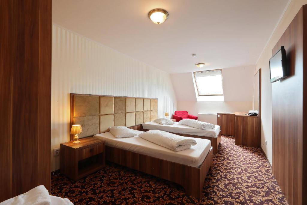 Postel nebo postele na pokoji v ubytování Hotel Impero