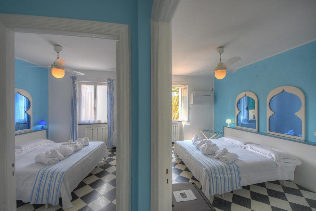 Posteľ alebo postele v izbe v ubytovaní Hotel Arabesque