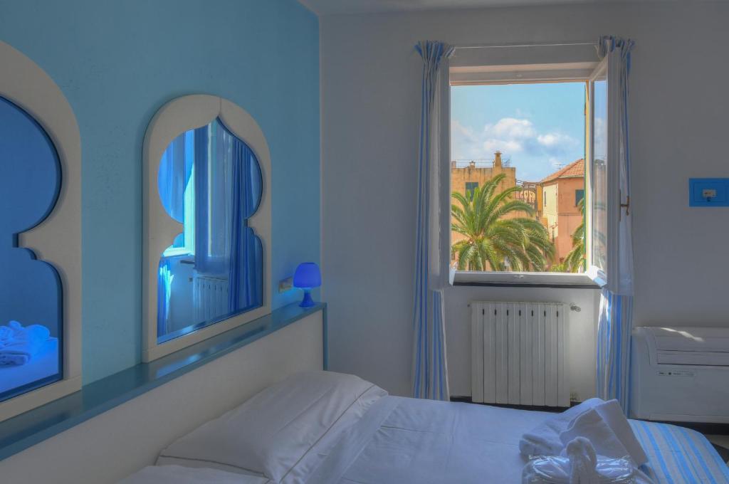 Posteľ alebo postele v izbe v ubytovaní Hotel Arabesque