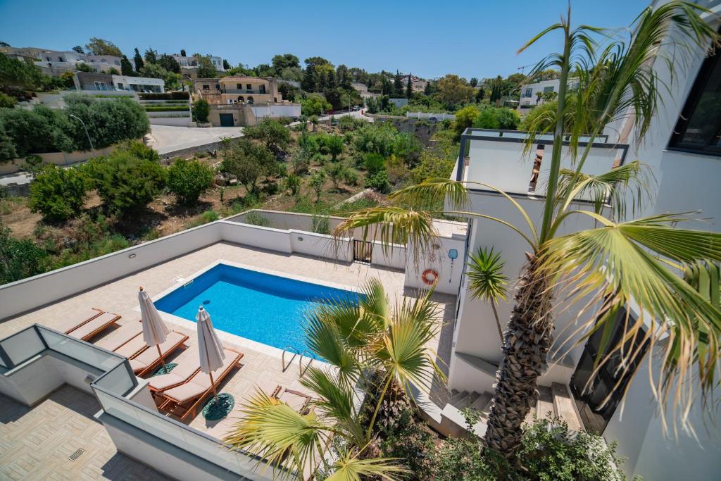 an aerial view of a swimming pool in a villa at Baldacchino Holiday Villas in Mellieħa