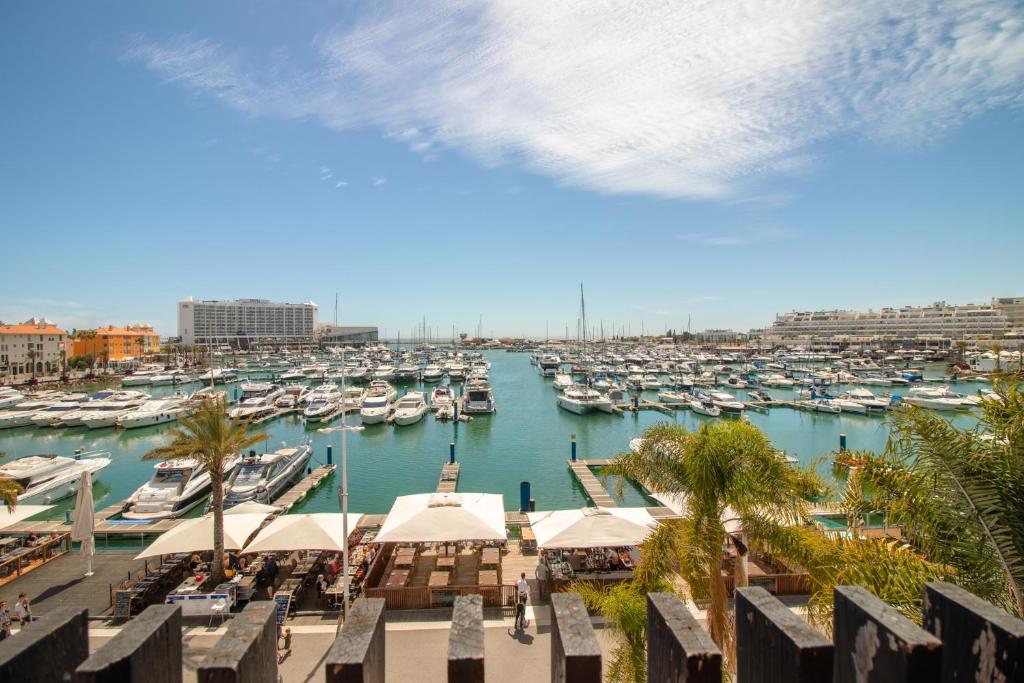 a view of a marina with boats in the water at Duplex Marina de Vilamoura in Vilamoura