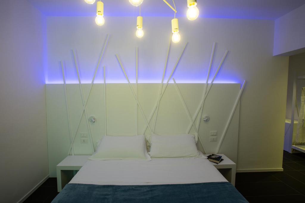 Postel nebo postele na pokoji v ubytování Sunrise Rooms