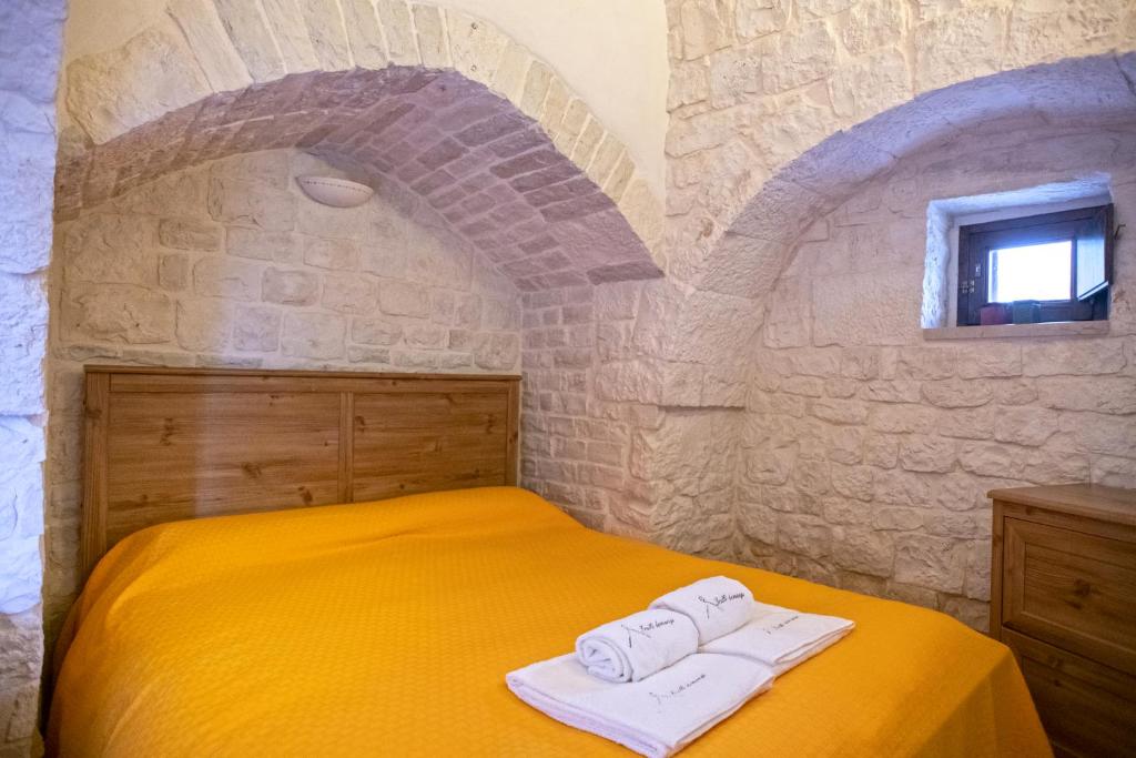 Postel nebo postele na pokoji v ubytování Il trulletto