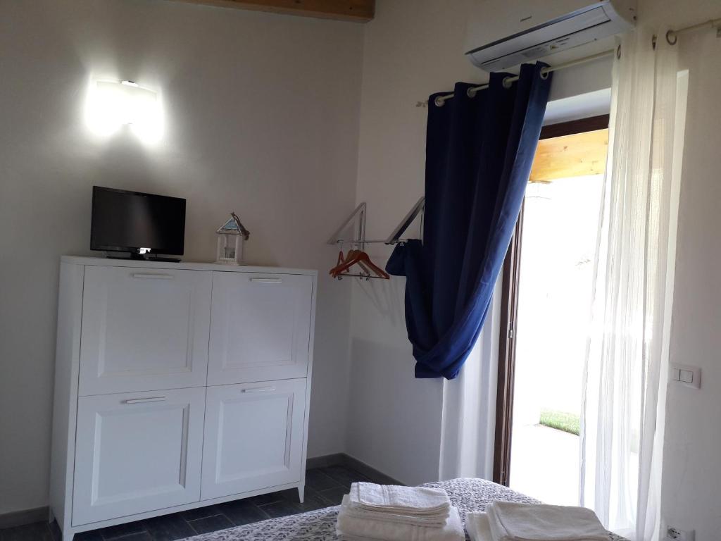 A bed or beds in a room at SardAma B&B Affittacamere