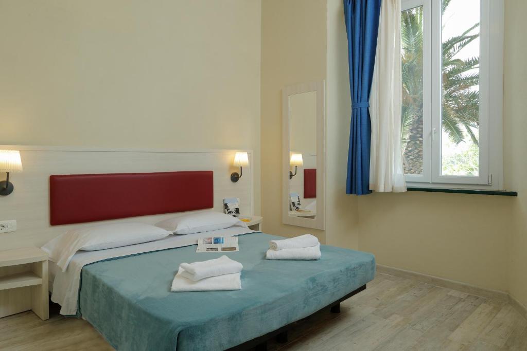 Posteľ alebo postele v izbe v ubytovaní Hotel Il Mulinaccio