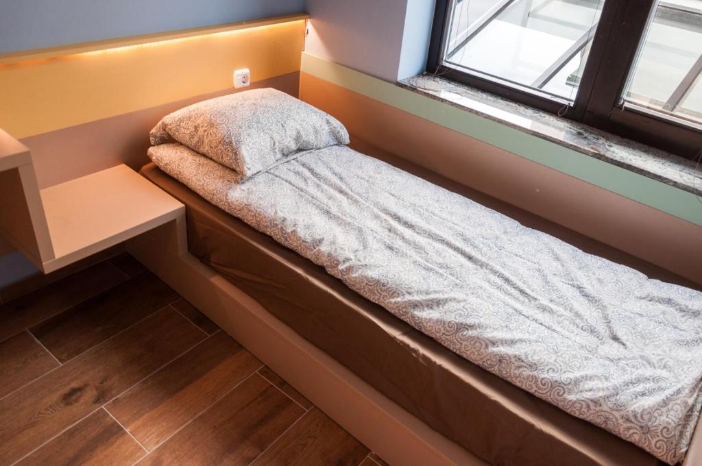 Postel nebo postele na pokoji v ubytování Ura Hostel