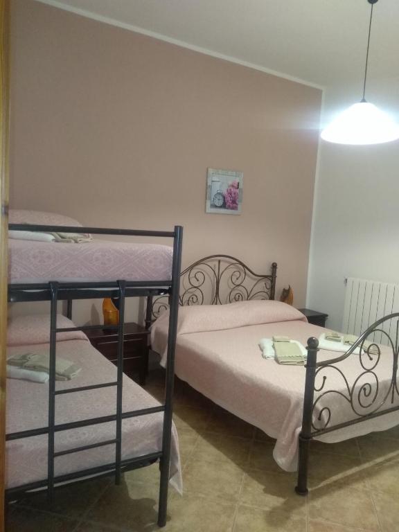Postel nebo postele na pokoji v ubytování Agriturismo Iloghe