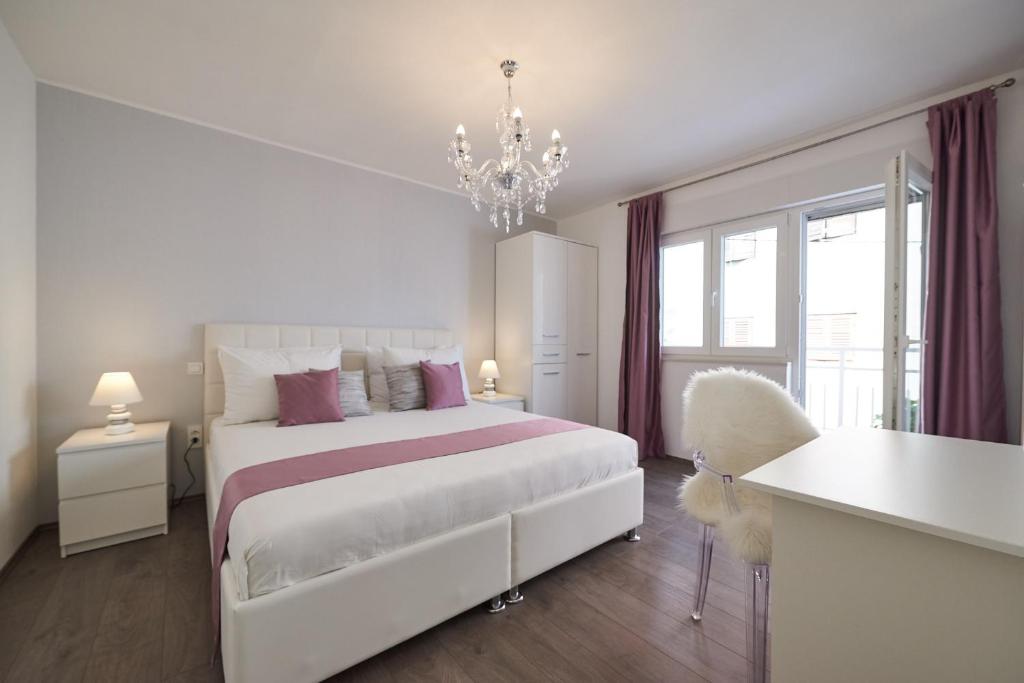 Postel nebo postele na pokoji v ubytování Apartment Epetij 2