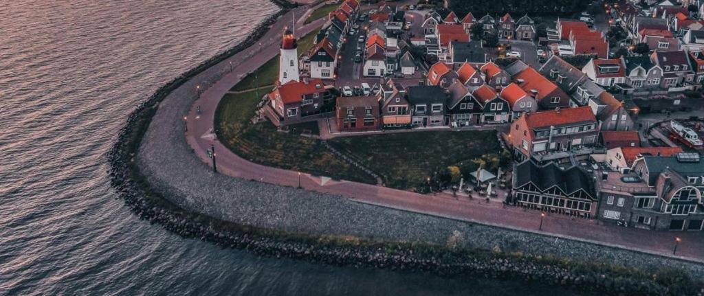 an aerial view of a town next to the water at B&B De Reede in Urk
