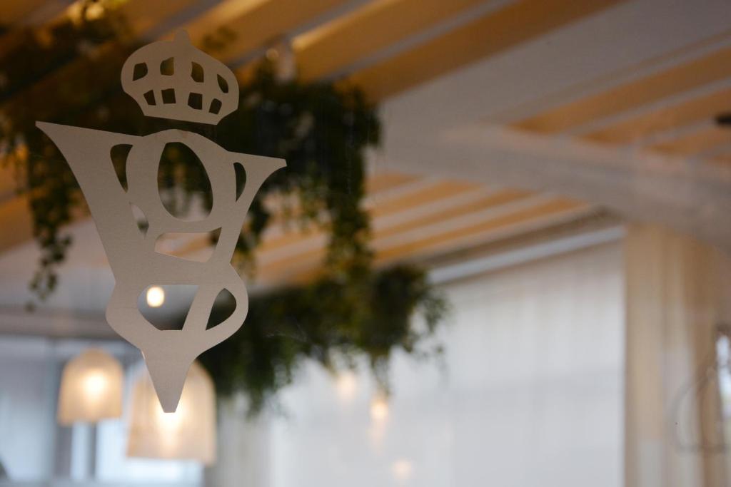 a sign hanging from the ceiling of a room at SH Villa Gadea in Altea