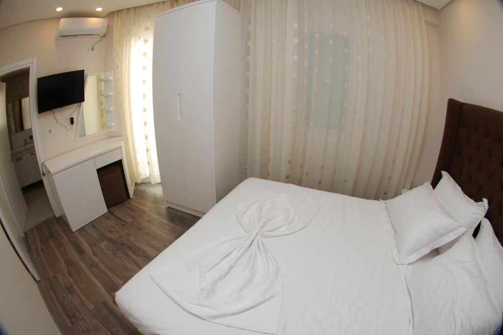 Postel nebo postele na pokoji v ubytování Hotel Ramo Saranda