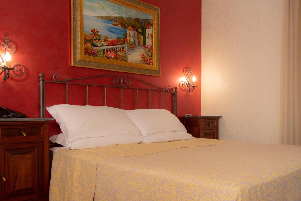 Postel nebo postele na pokoji v ubytování Hotel Gangi