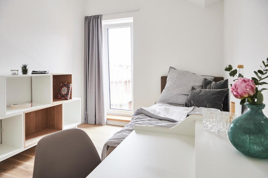 Postel nebo postele na pokoji v ubytování Boardinghome Oldenburg