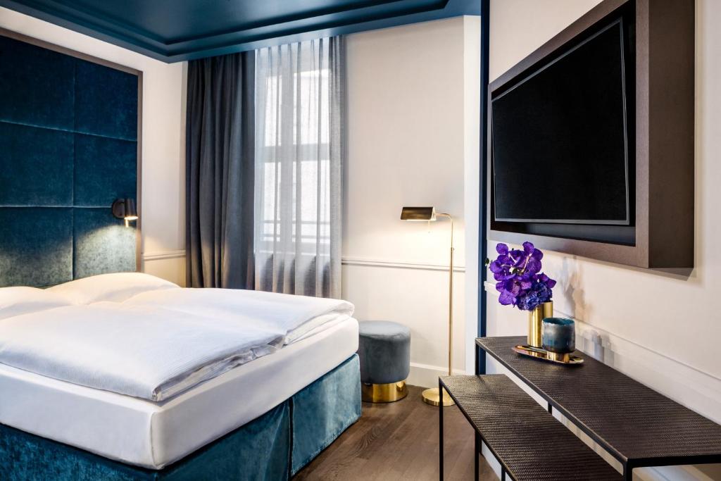 Postel nebo postele na pokoji v ubytování Hotel AMO by AMANO Friedrichstraße
