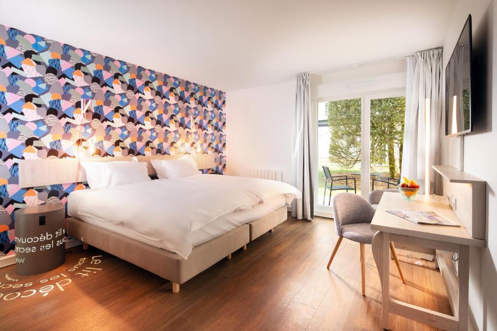 Llit o llits en una habitació de The Residence Hotel Geneva Airport