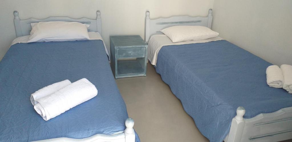 Łóżko lub łóżka w pokoju w obiekcie Passos Rooms