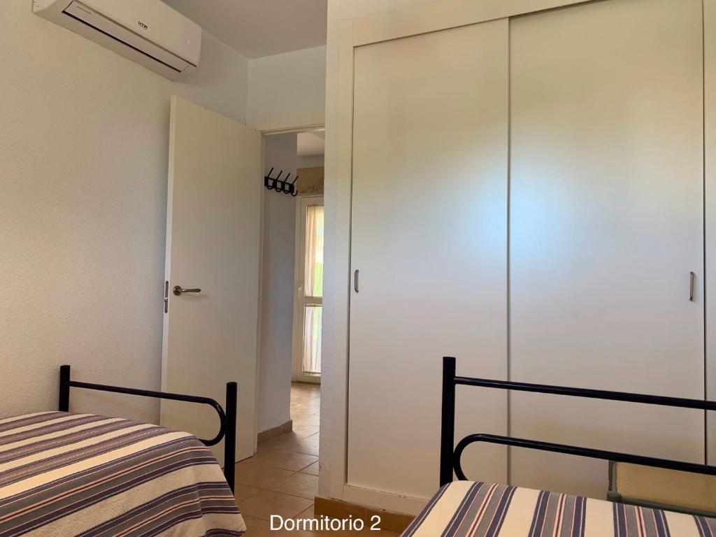 Posteľ alebo postele v izbe v ubytovaní Novo Sancti Petri - Adosado Residencial El Trebol - Chiclana