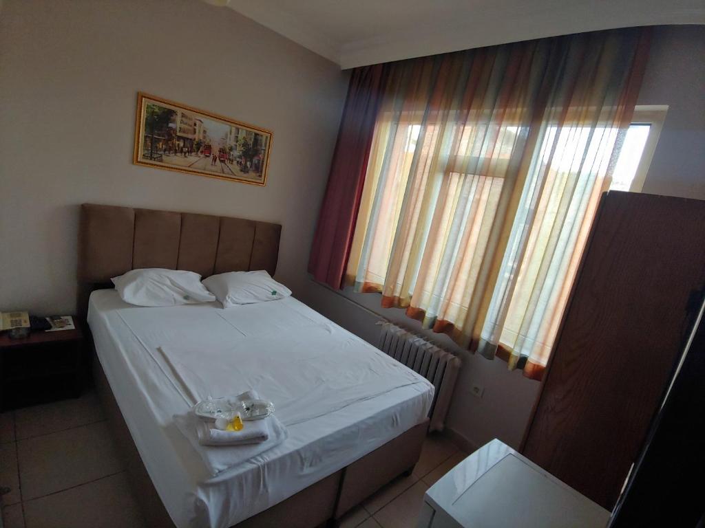 Postel nebo postele na pokoji v ubytování Hotel Yonca