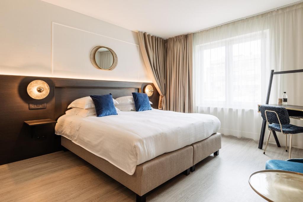 Tempat tidur dalam kamar di C-Hotels Continental