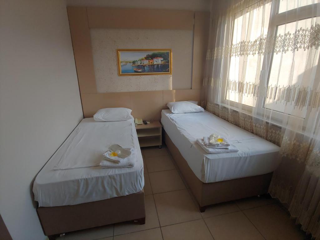 Postel nebo postele na pokoji v ubytování Hotel Yonca