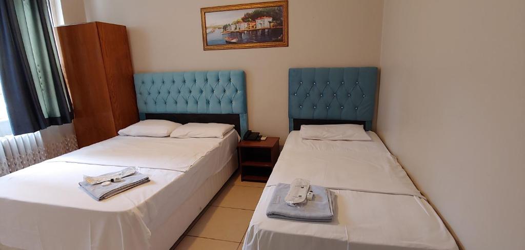 Postel nebo postele na pokoji v ubytování Hotel Yonca