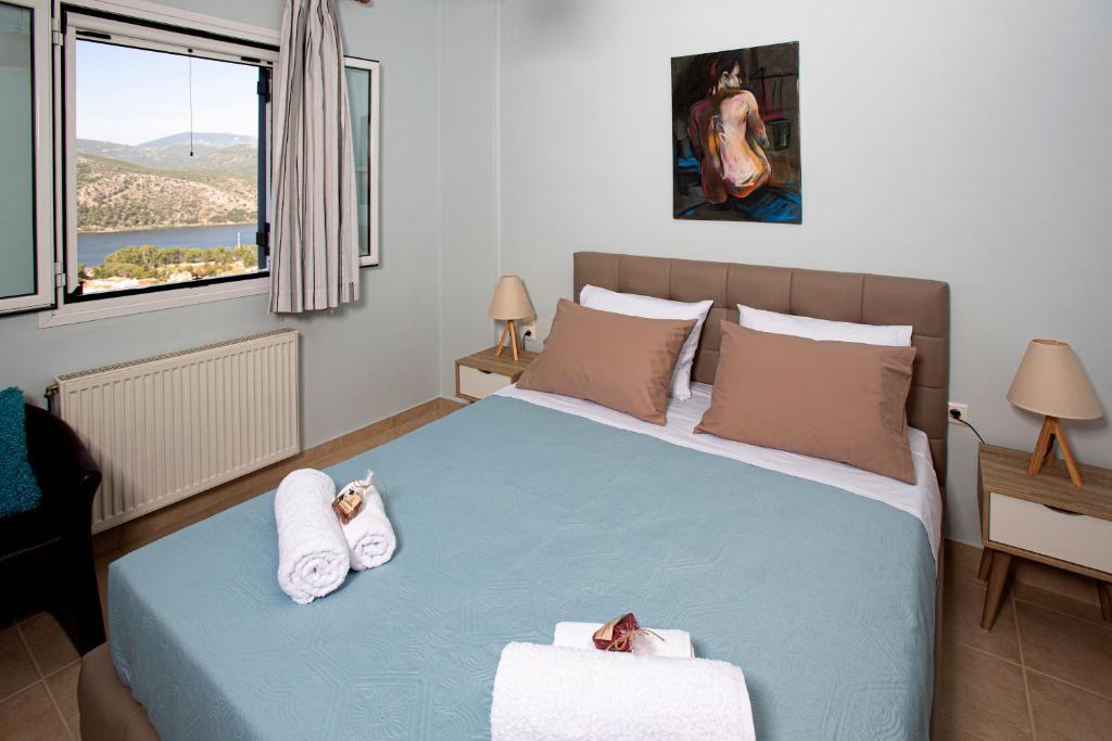 Łóżko lub łóżka w pokoju w obiekcie Antigone Apartments Argostoli (Spilia) 2