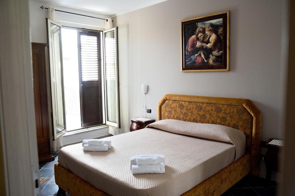 Postel nebo postele na pokoji v ubytování B&B Dimora di Girgenti