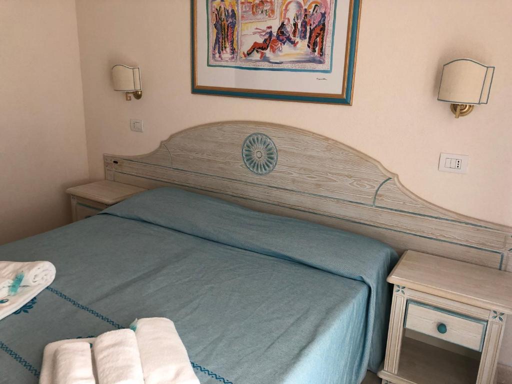 Postel nebo postele na pokoji v ubytování Hotel Riviera