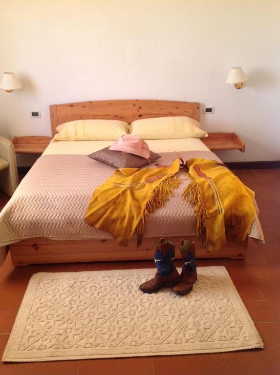 Postel nebo postele na pokoji v ubytování Agriturismo Ai Gradoni