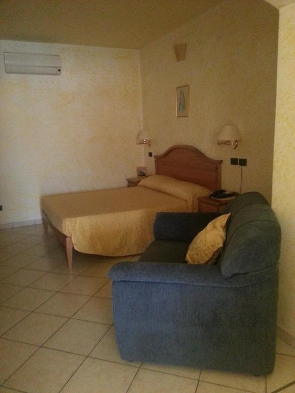 Postel nebo postele na pokoji v ubytování Hotel Mistef