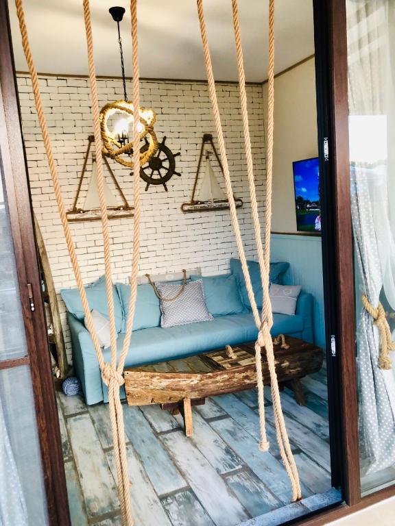 TV a/nebo společenská místnost v ubytování Arapya Beach Apartment