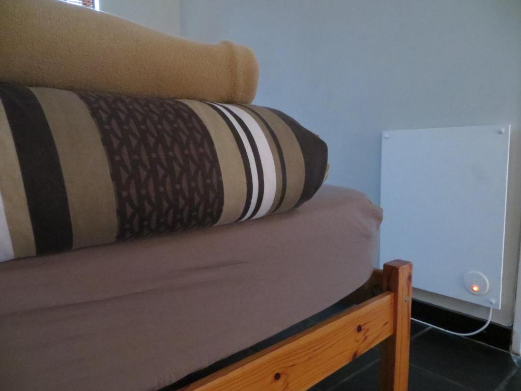 Postel nebo postele na pokoji v ubytování Cape Oasis Guesthouse