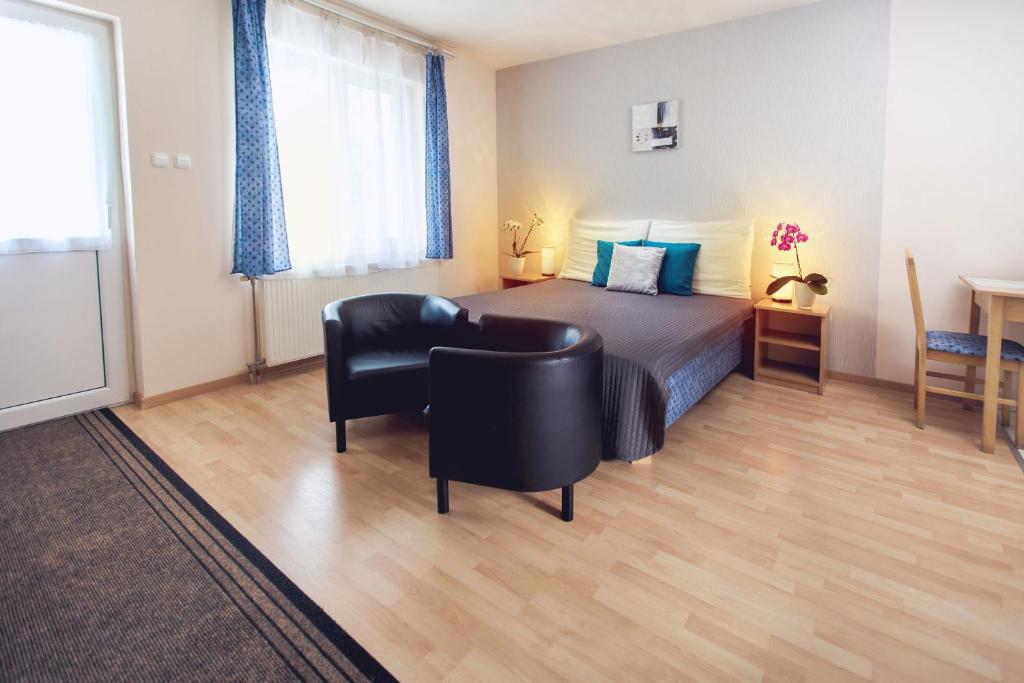 Posteľ alebo postele v izbe v ubytovaní Apartman Szanyi