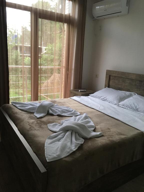 Postel nebo postele na pokoji v ubytování Cottages Ureki