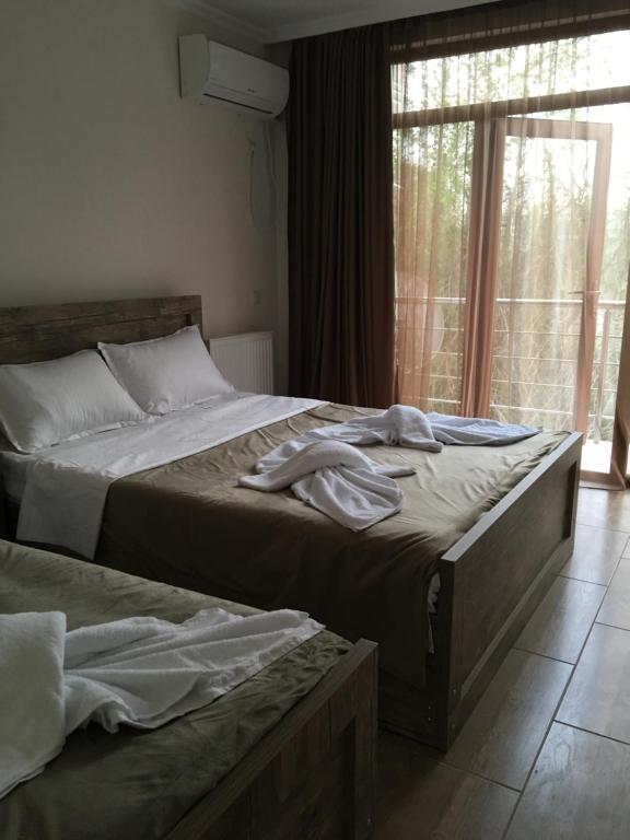 Postel nebo postele na pokoji v ubytování Cottages Ureki