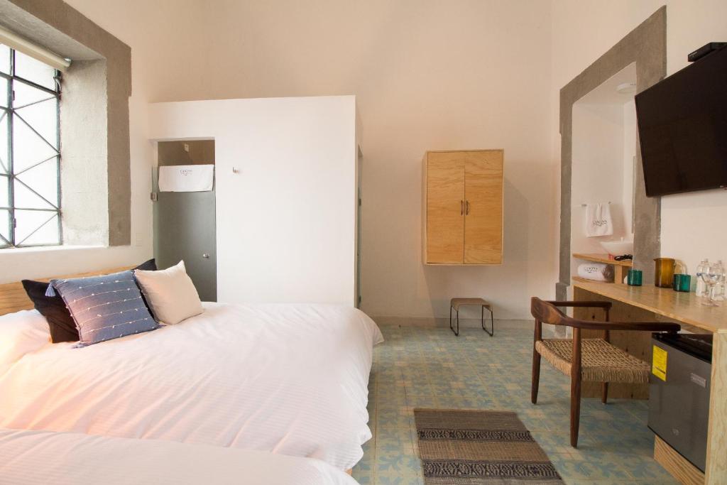 Postel nebo postele na pokoji v ubytování Hotel Casona Independencia
