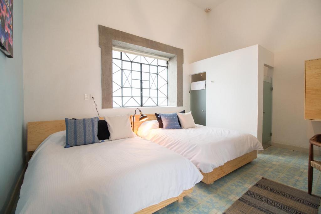 Postel nebo postele na pokoji v ubytování Hotel Casona Independencia