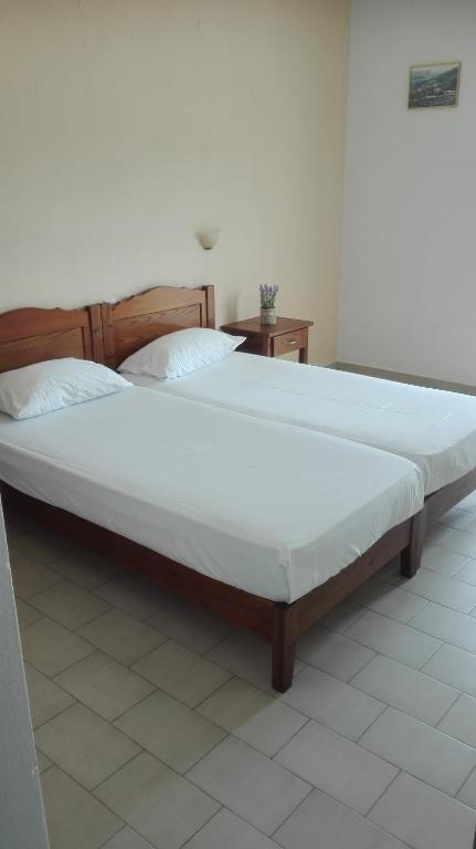 Postel nebo postele na pokoji v ubytování Alexandros Guest House