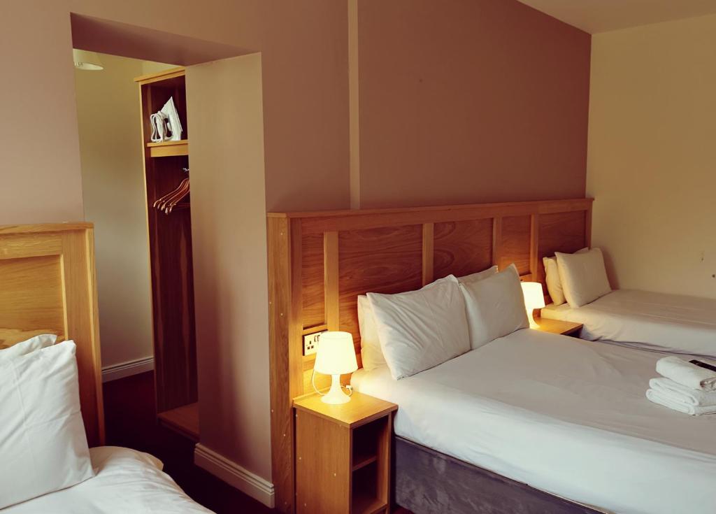 Postel nebo postele na pokoji v ubytování Bank House Guesthouse