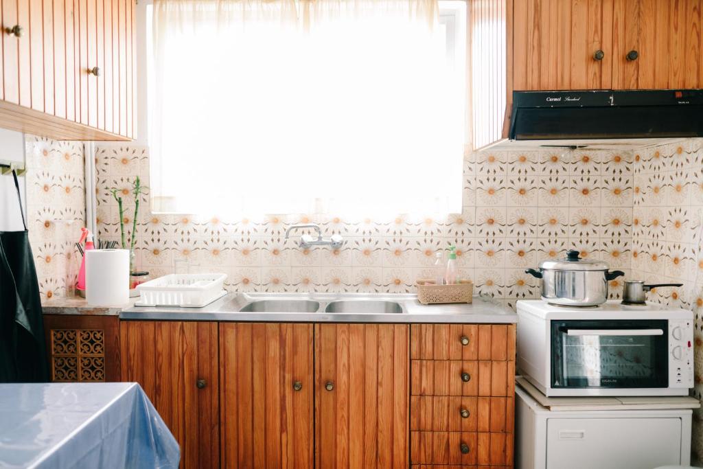 Kuchyň nebo kuchyňský kout v ubytování Toumpanakis Apartments