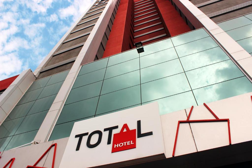 a toral hotel sign in front of a building at Total Hotel in Sao Paulo