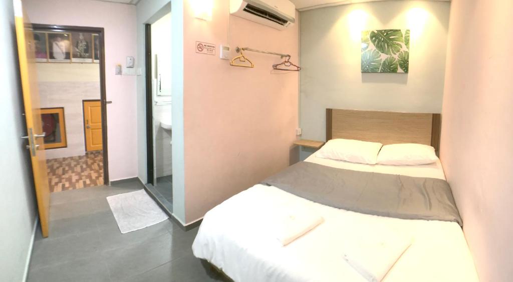 Postel nebo postele na pokoji v ubytování Grand Star Hotel