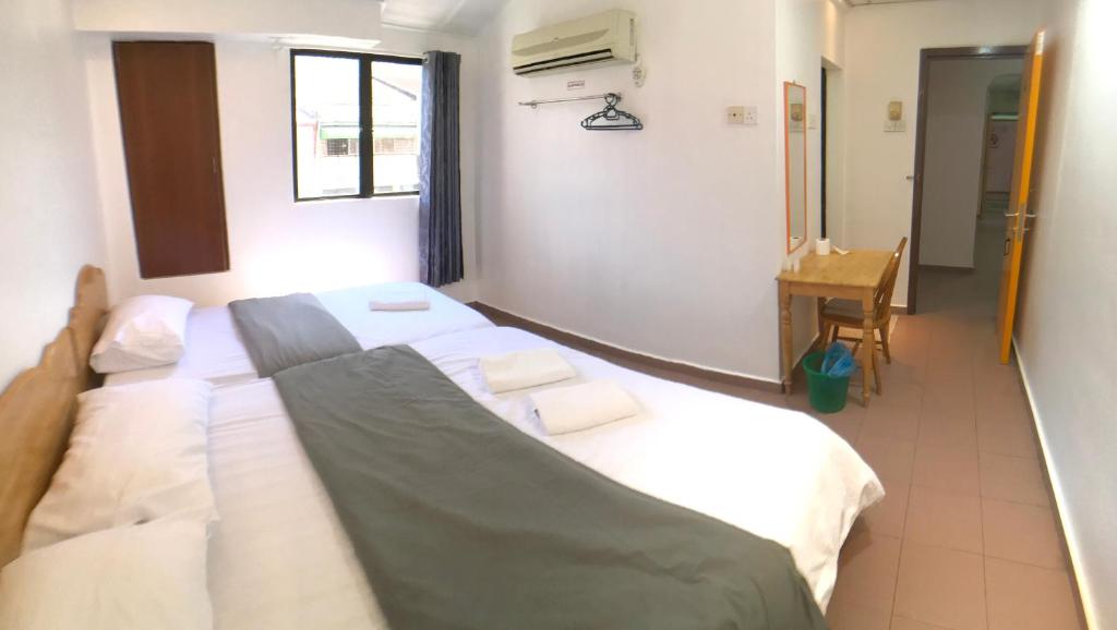 Postel nebo postele na pokoji v ubytování Grand Star Hotel