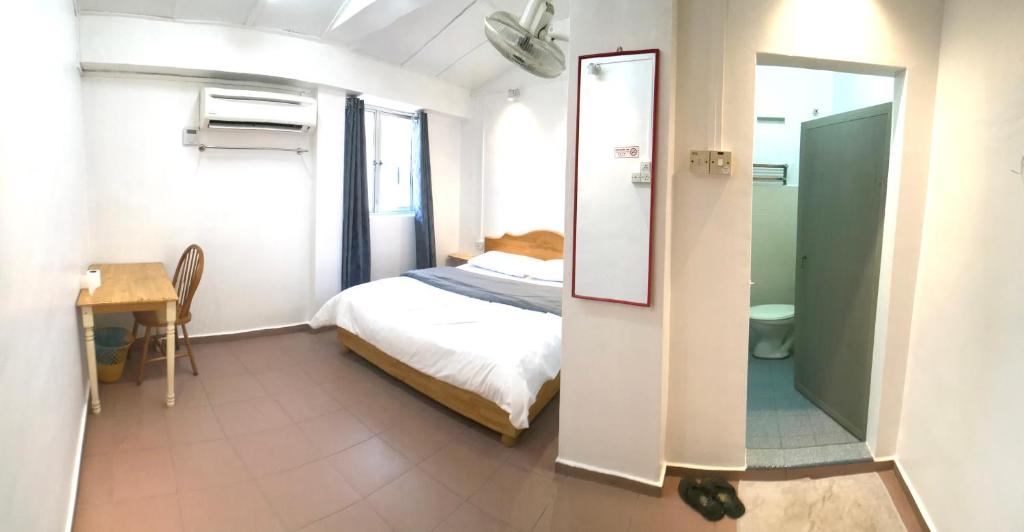 Postel nebo postele na pokoji v ubytování Grand Star Hotel