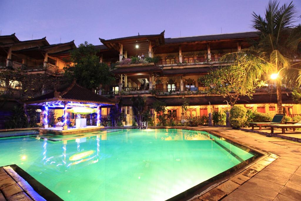 a large swimming pool in front of a building at Bali Sandy Resort in Kuta