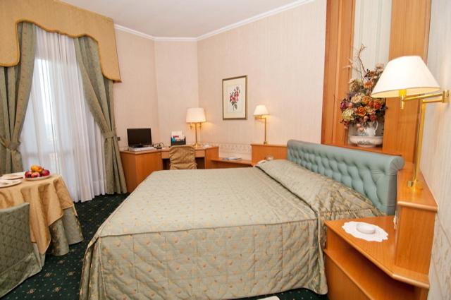 Postel nebo postele na pokoji v ubytování Hotel Ristorante Al Sorriso