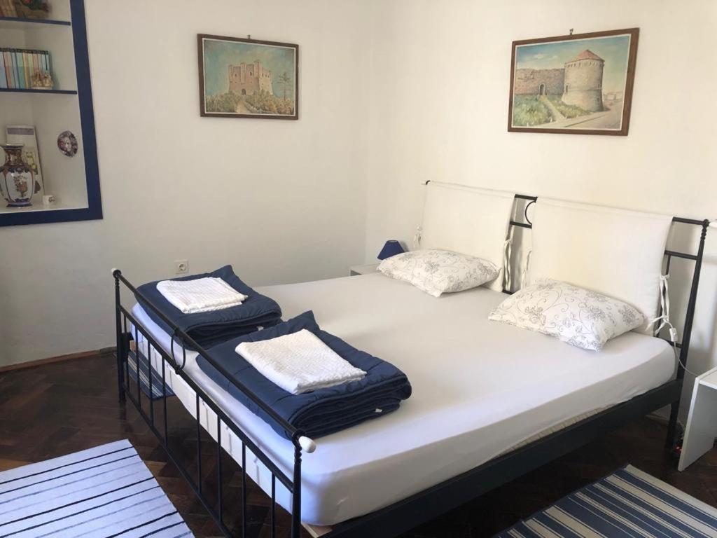 a bedroom with two beds with towels on them at Apartment Eleonora in Senj