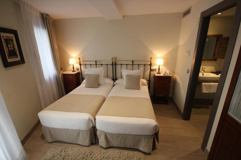 Кровать или кровати в номере Le Petit Boutique Hotel